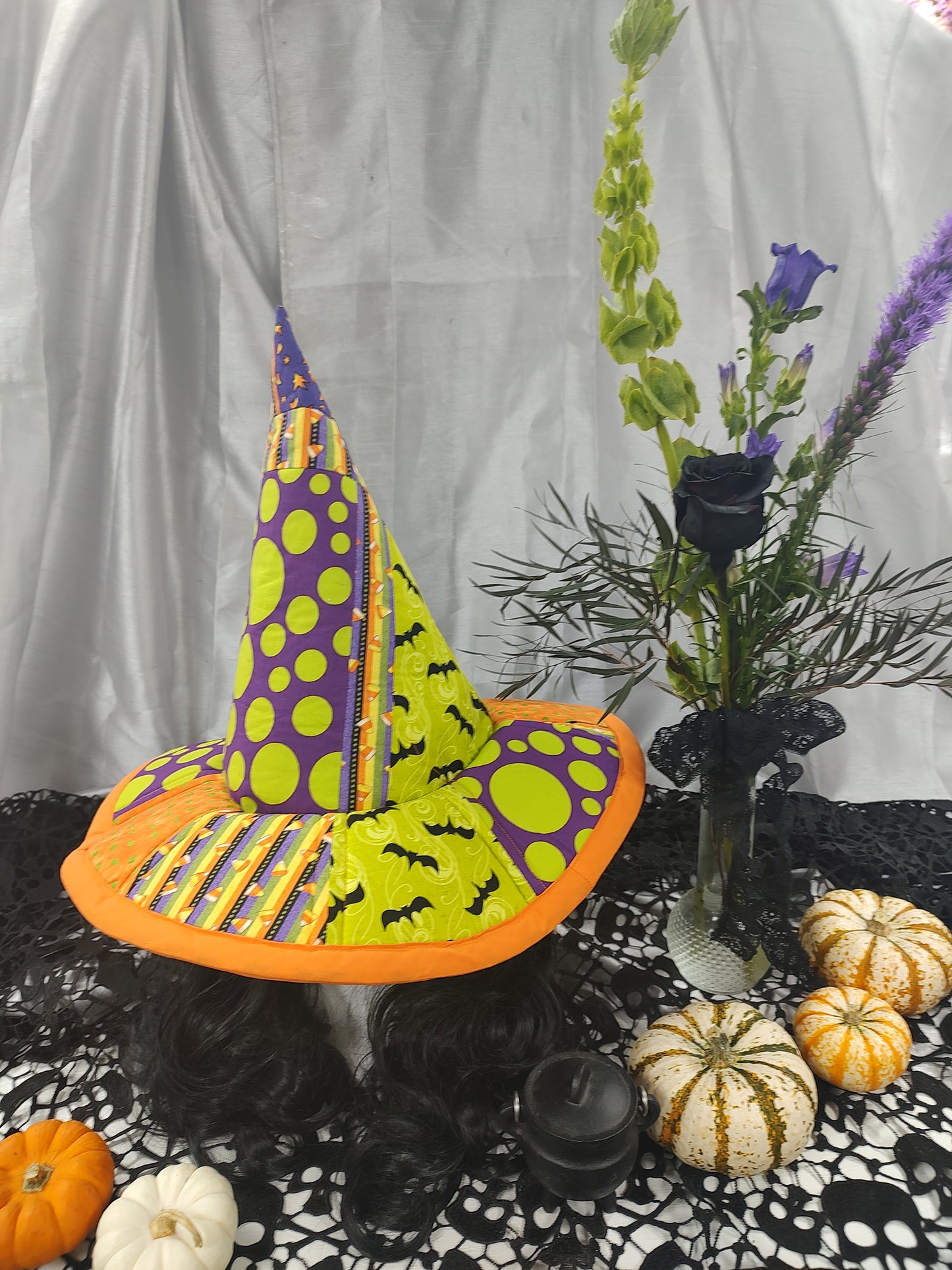 Local made witches hat with budvase of flowers
