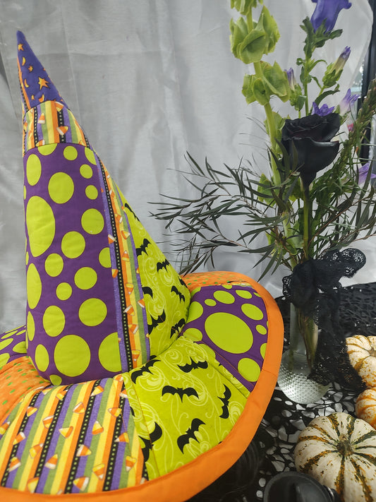 Local made witches hat with budvase of flowers